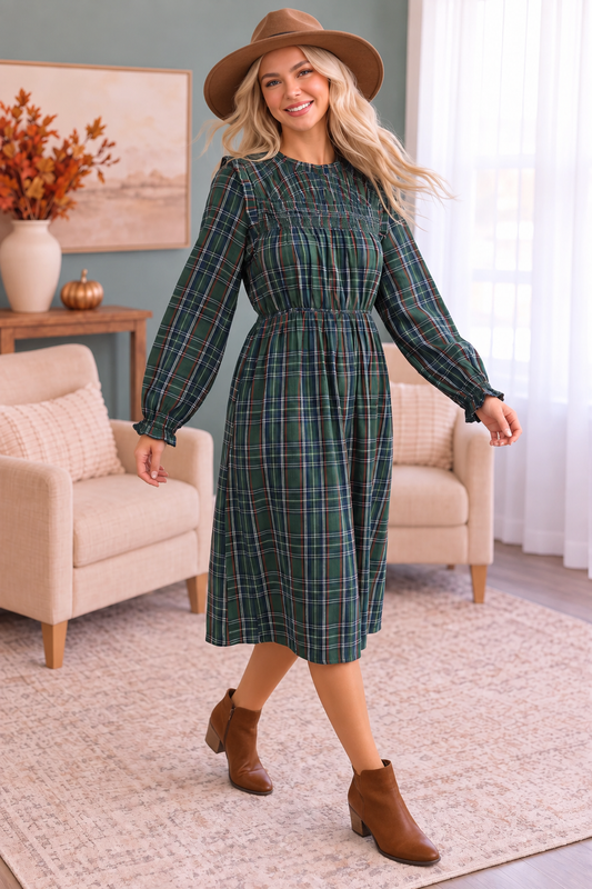 Green plaid midi dress styled with brown ankle boots and a soft brown suede hat