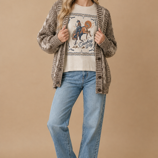 AI-styled outfit featuring the Cowboy Way graphic thermal top with a two-tone chunky cable cardigan and straight-leg jeans.