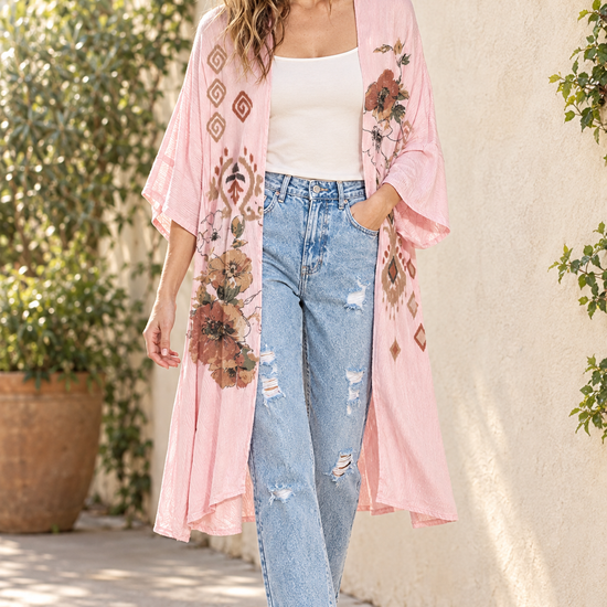 AI-styled outdoor outfit with pink floral kimono, distressed mom jeans, ivory tank and tan ankle boots