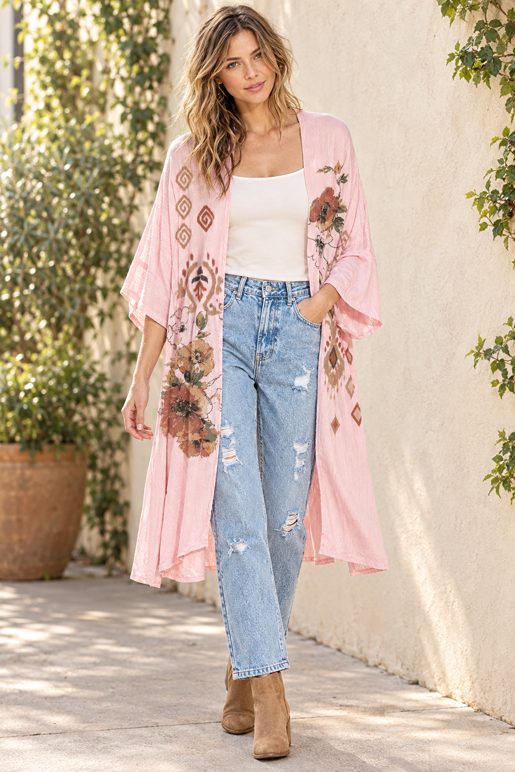 AI-styled outdoor outfit with pink floral kimono, distressed mom jeans, ivory tank and tan ankle boots