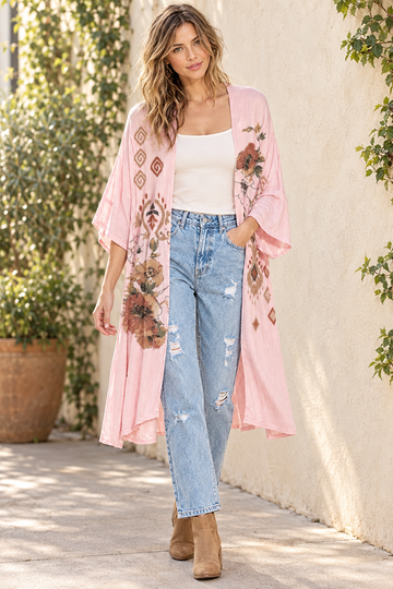 AI-styled outdoor outfit with pink floral kimono, distressed mom jeans, ivory tank and tan ankle boots
