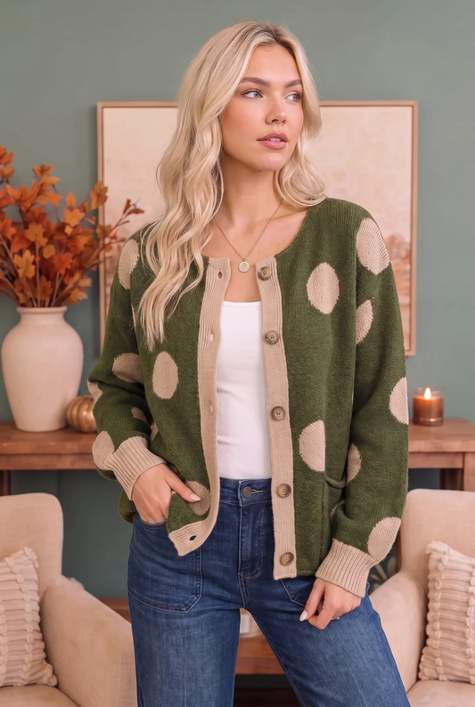 Front view of an olive button-front cardigan with cream polka dots, contrast trim, and pockets
